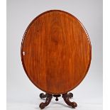 A 19th century mahogany oval snap top centre table on four carved downswept supports, 140cm...