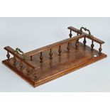 A Victorian figured walnut twin section book tray with turned gallery, 61cm wide; 37cm deep