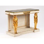 An Egyptian revival console, the painted faux marble top on pair of gilt figural supports,...
