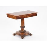A William IV rosewood fold over card table on carved and turned column and four paw feet, 91cm...