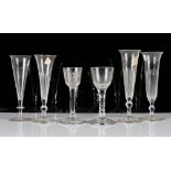 A group of six drinking glasses, 18th and 19th century, comprising; a plain stemmed wine glass...
