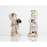 Two Meissen figures of vintners, late 19th century, the first modelled as a boy holding a hat...