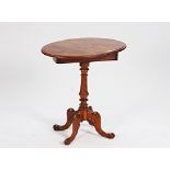 A Victorian figured walnut oval drop flap occasional table, on spiral column and scroll...