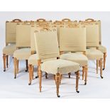A set of ten Victorian dining chairs with loose hessian upholstery and bleached out frames on...