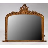 A Victorian gilt framed arch top overmantel mirror with scroll crest, 126cm wide x 107cm high.