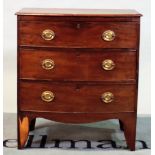 A 19th century bowfront chest of three long graduated drawers