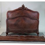 A late 19th century French hardwood arch topped double bed