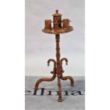 A late 19th century Continental gilt metal mounted stained beech smoker's stand, on a tripod...