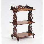 A Victorian mahogany three tier what-not with pierced fret supports, 60cm wide x 100cm high.