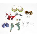 A collection of nine pairs of mostly costume earrings and earclips in a variety of designs, (9).