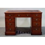 'William Whiteley, London', an early 20th century walnut pedestal desk with nine drawers about...
