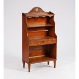 A late 19th century polychrome painted satinwood waterfall four-tier open bookcase