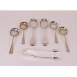 A group of silver table flatware, comprising; four rat tail pattern soup spoons, Sheffield...