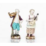 A pair of Meissen figures of musicians, late 19th century, modelled as a boy playing a French...