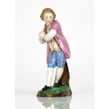 A Hochst Damn earthenware figure of a young man, 19th century, modelled standing before a tree...