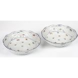 A pair of Schumann, Bavaria, circular pierced bowls, 20th century, each painted with flowers...