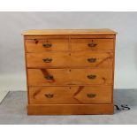 An Edwardian pine chest of two short and three long graduated drawers