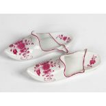 Two similar Meissen outside decorated slippers, late 19th century, each painted in puce...