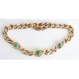 A gold and turquoise set curb link bracelet, on a snap clasp, detailed 15 CT, fitted with a...