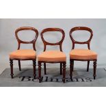 A set of six Victorian mahogany balloon back dining chairs on turned supports