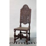 A 19th century continental walnut and embossed leather high back dining chair