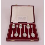 A set of six silver teaspoons, having differing picture backs to the bowls of the spoons,...