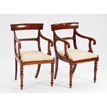 A pair of early Victorian mahogany open armchairs, on turned supports, 52cm wide x 88cm high, ...