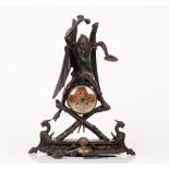 A bronze and painted-metal mounted 'Devil band' mantel clock