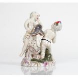 A German porcelain group of two putti, probably Meissen, emblematic of America and Europe, the...