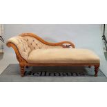 An Edwardian mahogany framed chaise longue with buttonback upholstery