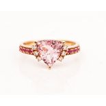 A rose colour gold, morganite, pink sapphire and diamond ring, claw set with the curved...