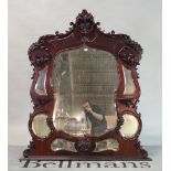 A late Victorian mahogany framed mirror back, with an arrangement of bevelled plates and shelves,