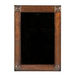 An Arts and Crafts copper rectangular wall mirror