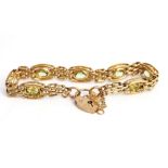 A 9ct gold and peridot bracelet.