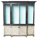 A George III style polychrome painted breakfront cabinet, with open shelves over four...