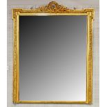A large late 19th century gilt framed overmantel mirror.