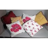 A group of six modern cushions, various designs and sizes, the largest 41cm x 41cm