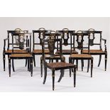 A set of eight Regency gilt metal mounted ebonised cane seat dining chairs (8).