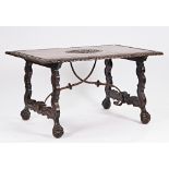 A 19th century Spanish walnut centre table, the rectangular top with carved crest on shaped...