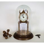 A modern brass anniversary clock, with glass dome, 31cm high