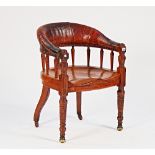 A late Victorian oak and leather upholstered tub back desk chair, on spiral fluted supports,...