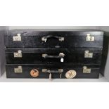A set of three vintage graduated black canvas hard shell suitcases, 95cm wide