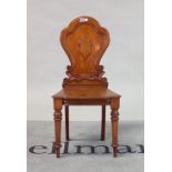 A Victorian mahogany hall chair, with shield back, 45cm wide; 90cm high