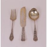 A Sterling serving slice, a Sterling serving fork, with floral pierced decoration to the...