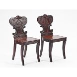 A pair of Regency mahogany hall chairs (2).