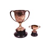 A silver twin handled trophy cup, presentation inscribed, height 14.5cm, Sheffield 1928, with...