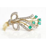 An 18ct gold, diamond and emerald brooch, designed as a spray, mounted with five square cut...