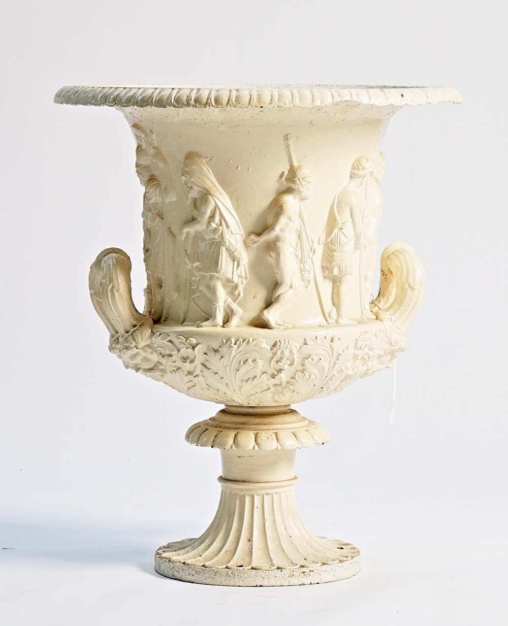A white painted cast-iron urn