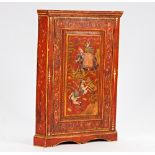 An 18th century oak hanging corner cabinet, later polychrome painted with an Indian scene...