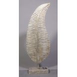 A modern silver painted hardwood sculpture of a leaf